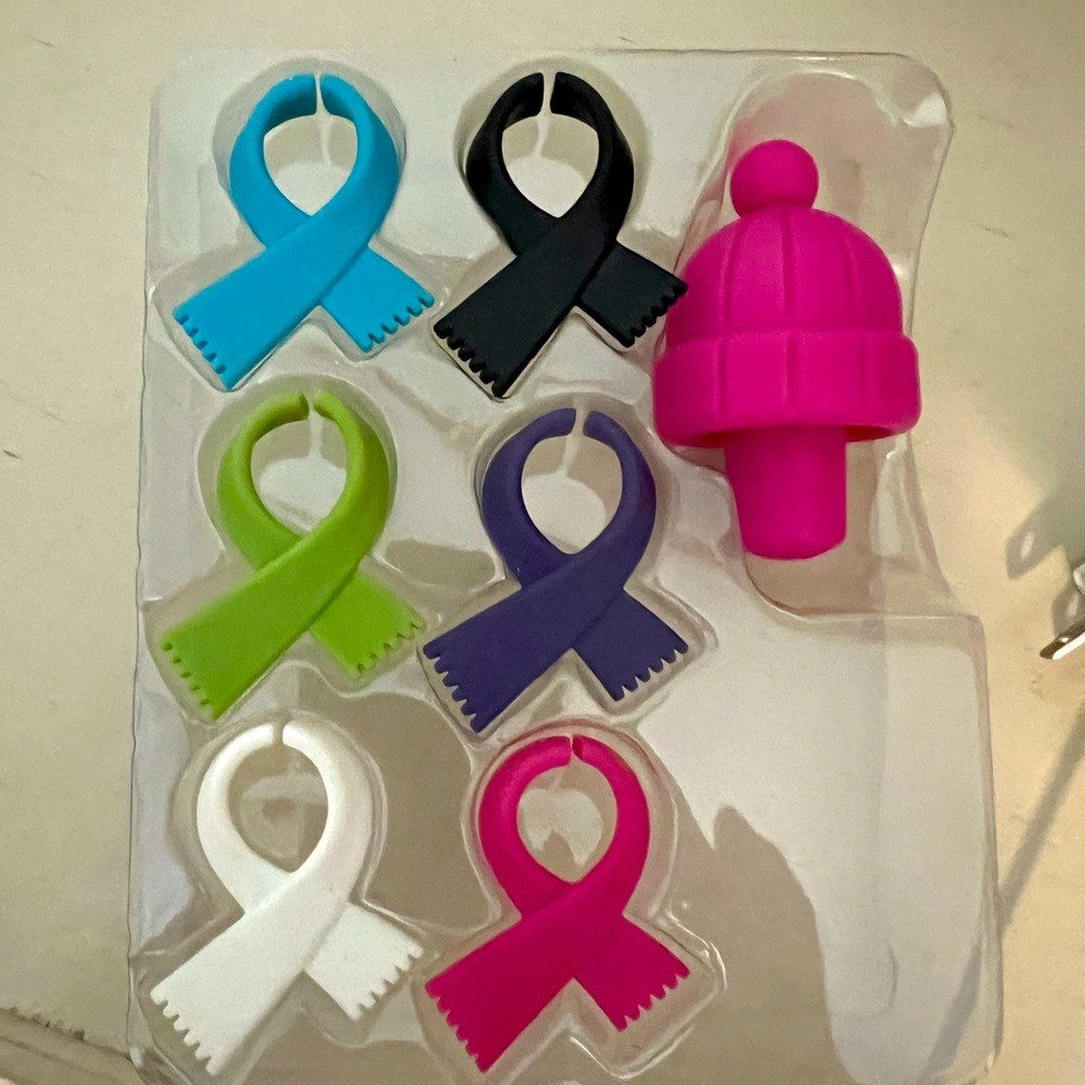 Wine glass scarf charms and winter hat wine bottle stopper.